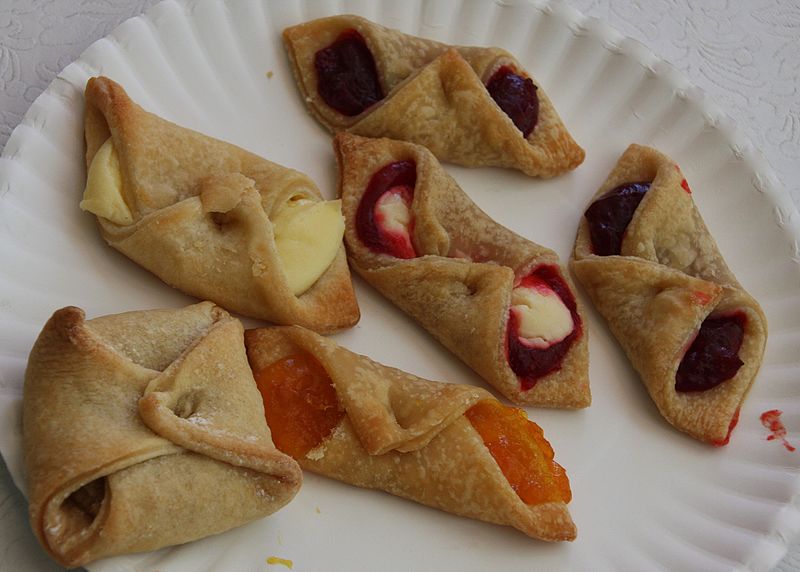 assorted flavors of kolachy cookies served on a paper plate