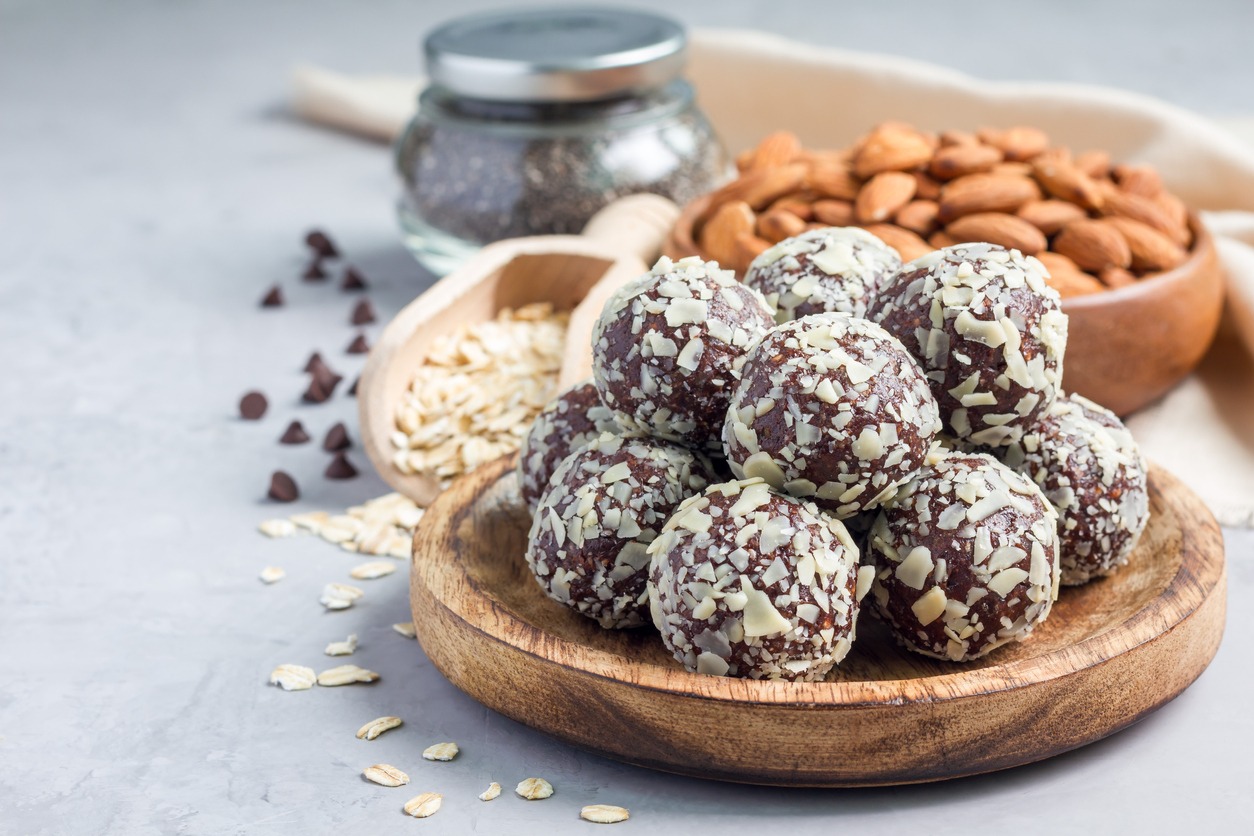 Healthy homemade paleo chocolate energy balls, horizontal, copy space