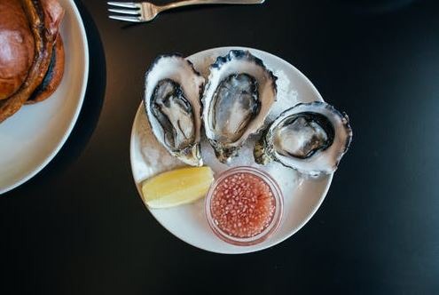 Roasted Hake with Clams, Cider Sauce, and Dill Oil