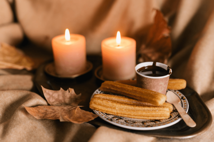 a plate of churros with chocolate dip