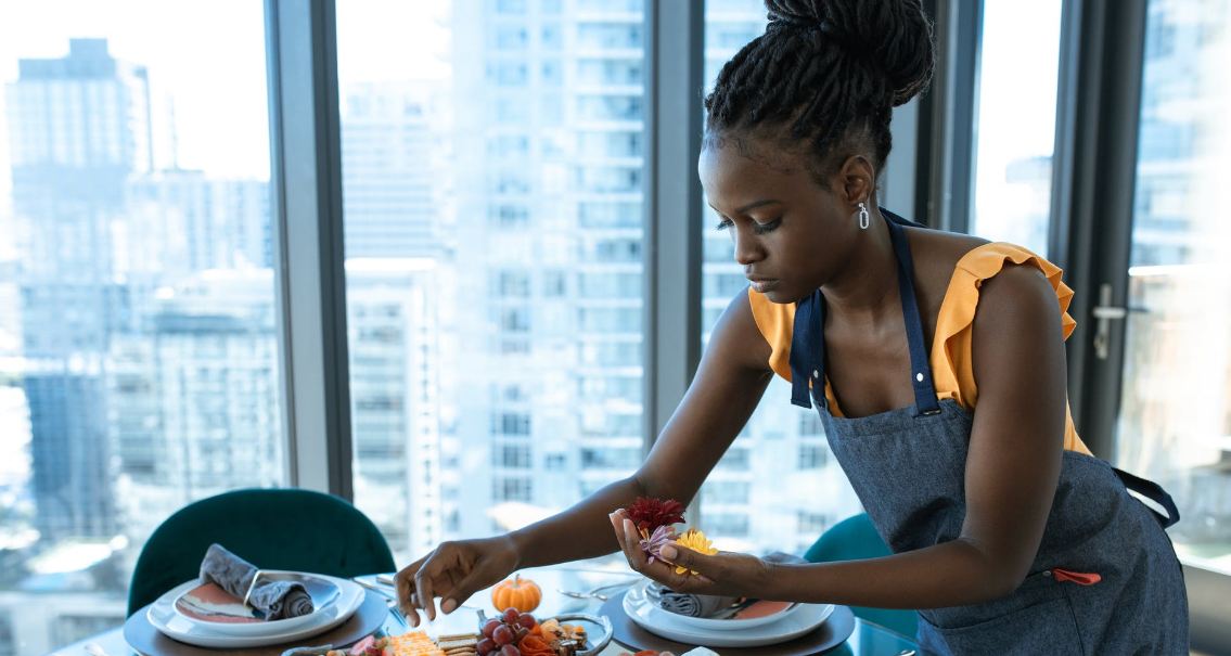 woman fixing the cheese platter