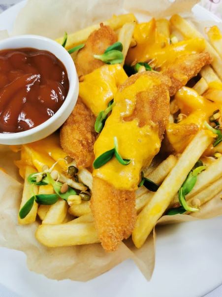 Chicken fillet on French fries