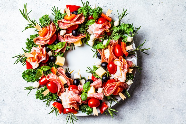 Christmas wreath of festive appetizer. Canapes with cheese, vegetables and ham. Christmas food concept.