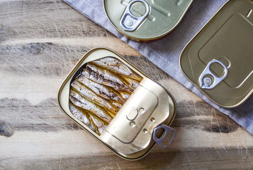canned sardines on a table