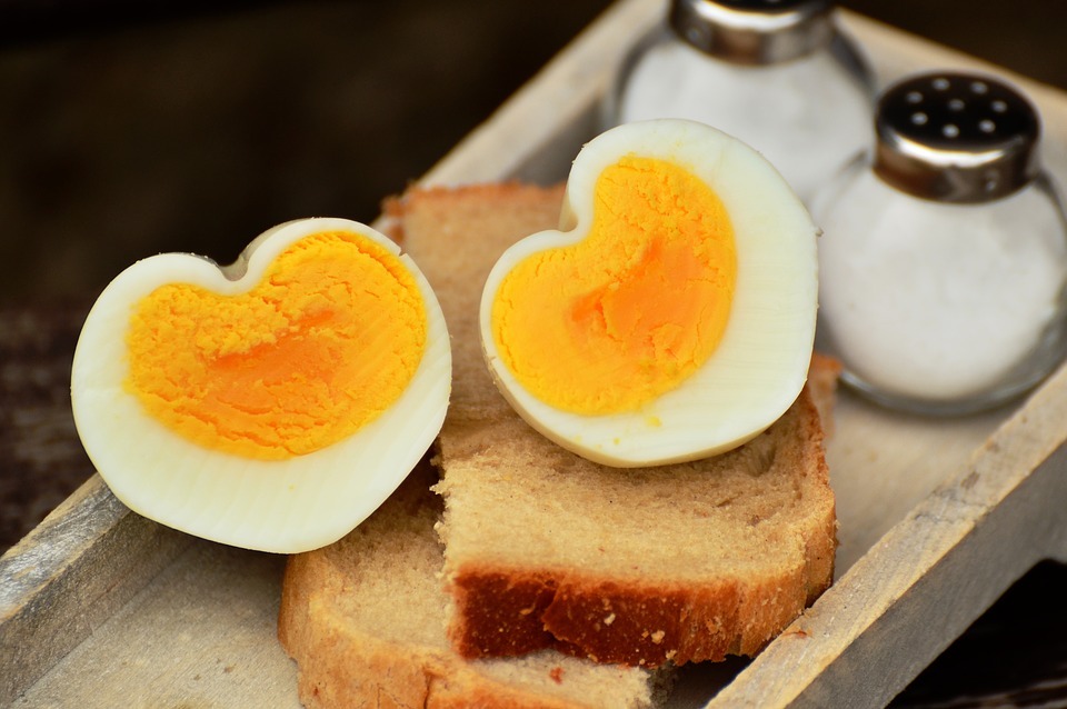 heart-shaped hard-boiled eggs with bread