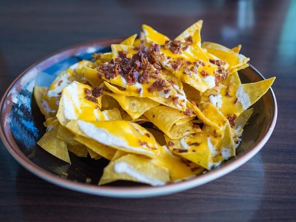 Nacho chips with cheese and chili toppings