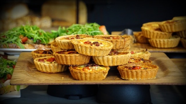 a picture of miniature quiches stocked in a pile