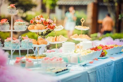 A buffet table at an outdoor baby shower