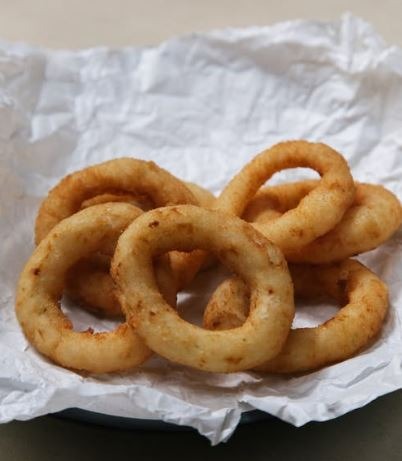 a close-up image of onion rings