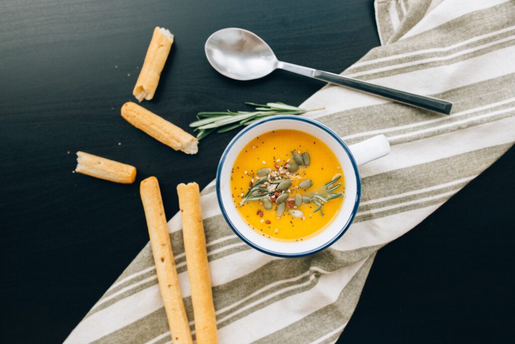 yellow soup in a bowl image